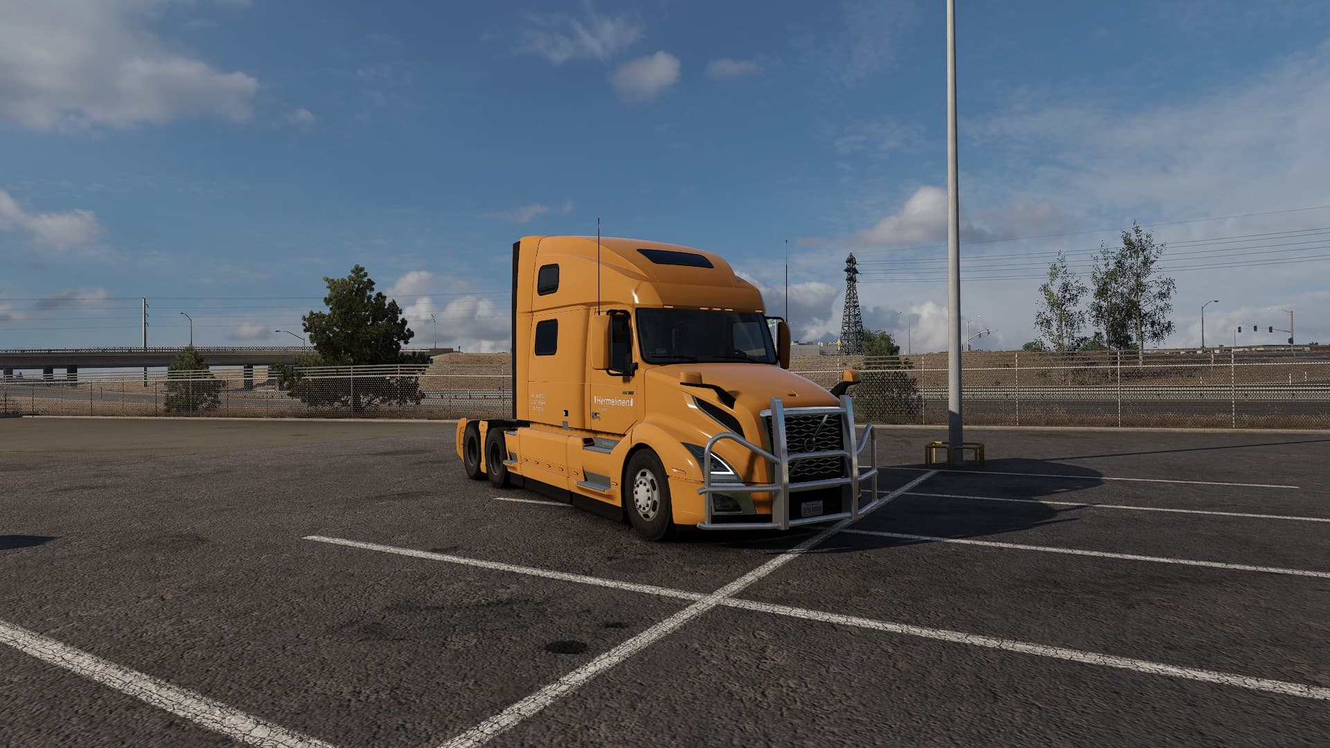 An orange truck on a parking lot